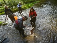 Hydrobiologist Michal Bílý's team in the field